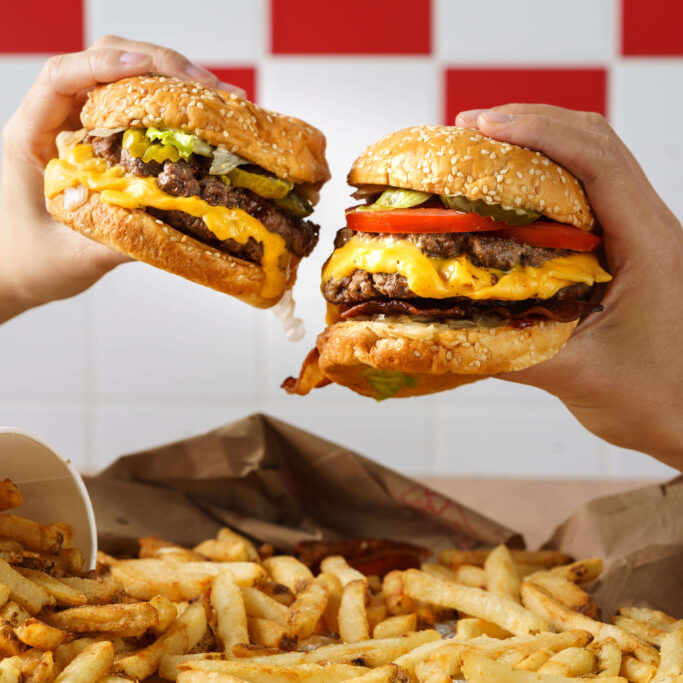 Food Photographer Singapore Five Guys Two hands holding burger